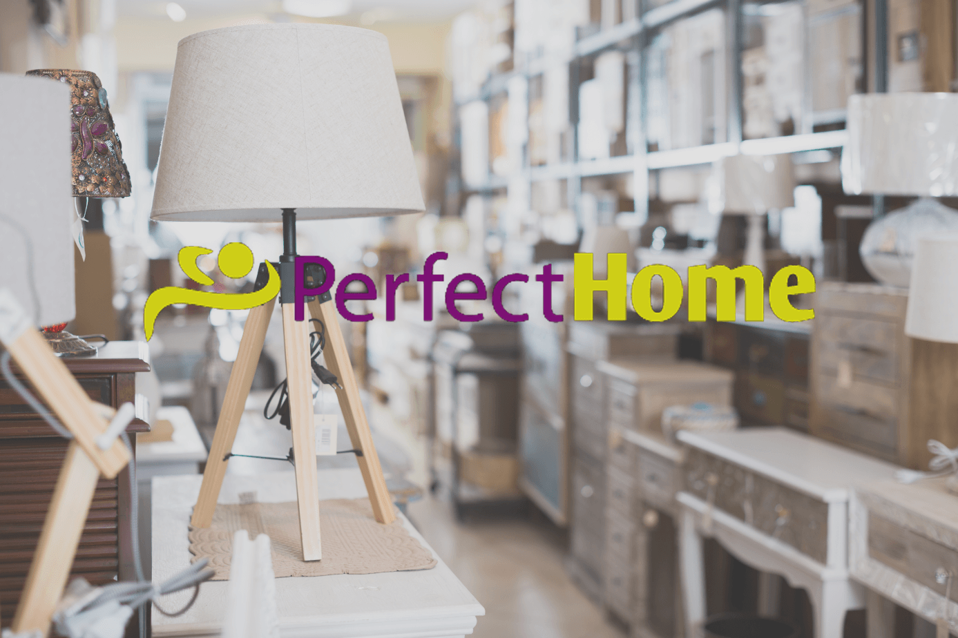 A lamp is sitting on a table in a perfect home store.