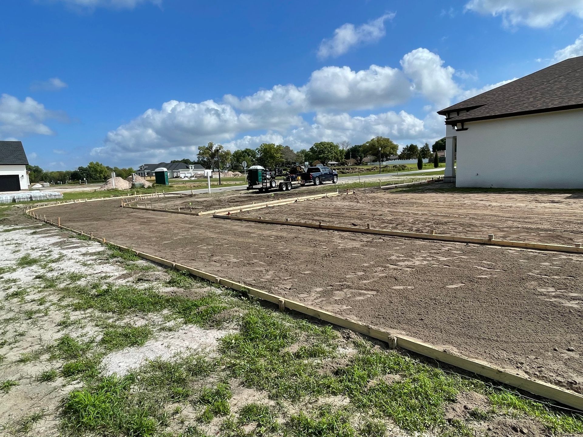 A house is being built in the middle of a grassy field.
