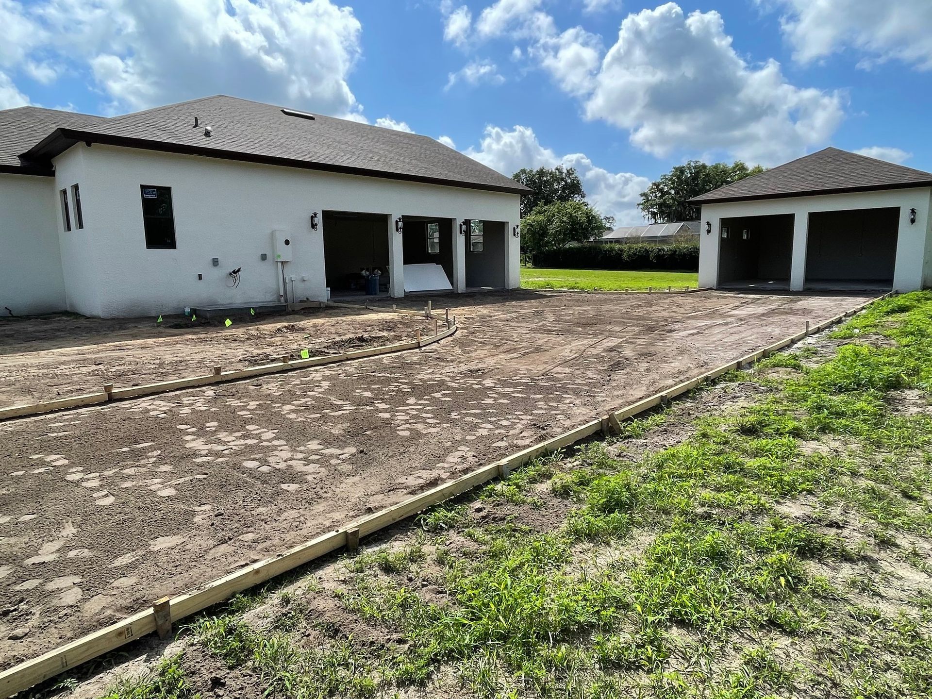 A house with a lot of dirt in front of it