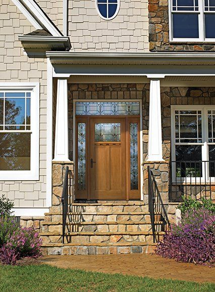 A house with a wooden door and stone steps