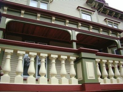 A large house with a balcony and a railing