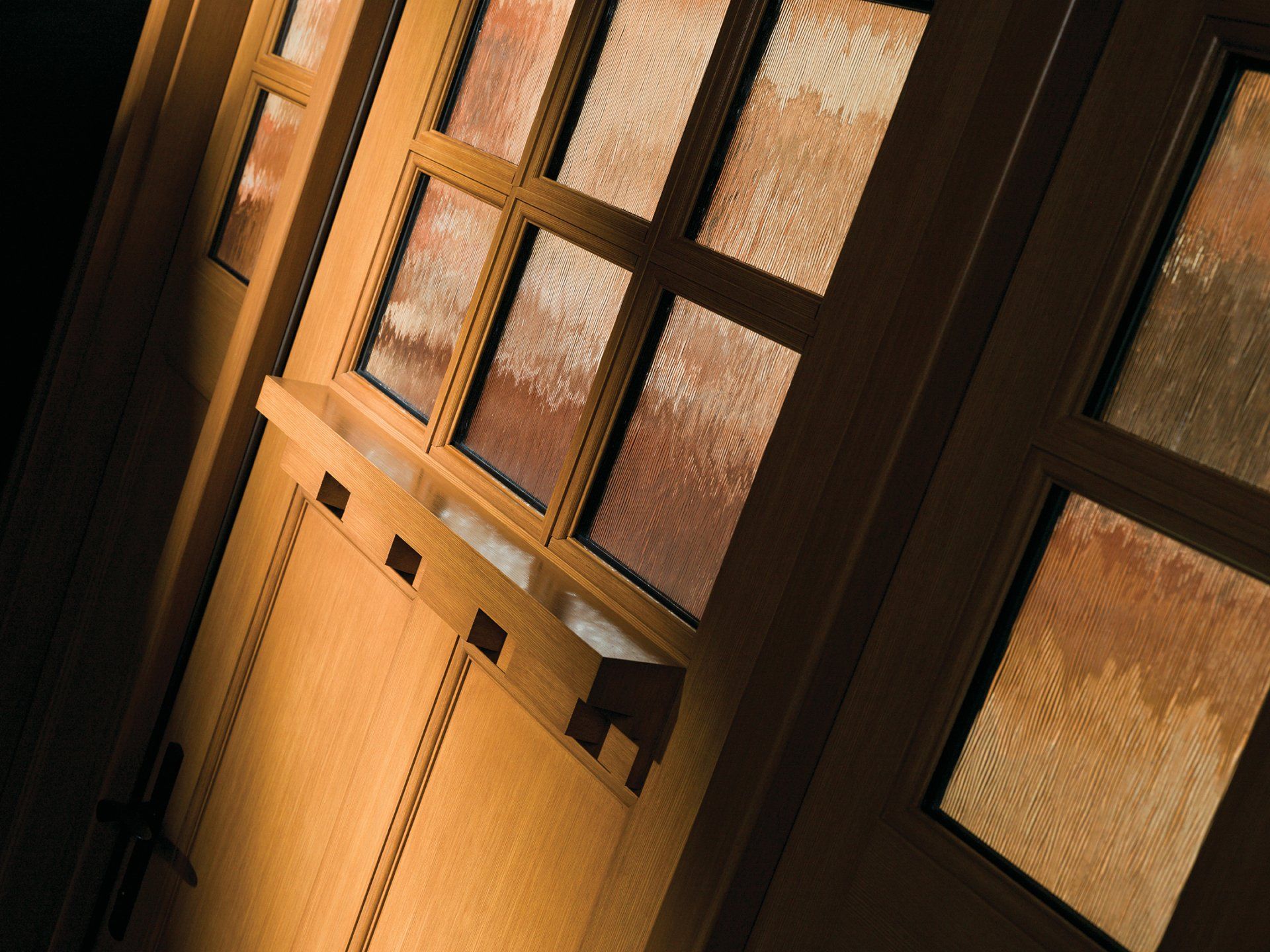 A close up of a wooden door with a lot of windows