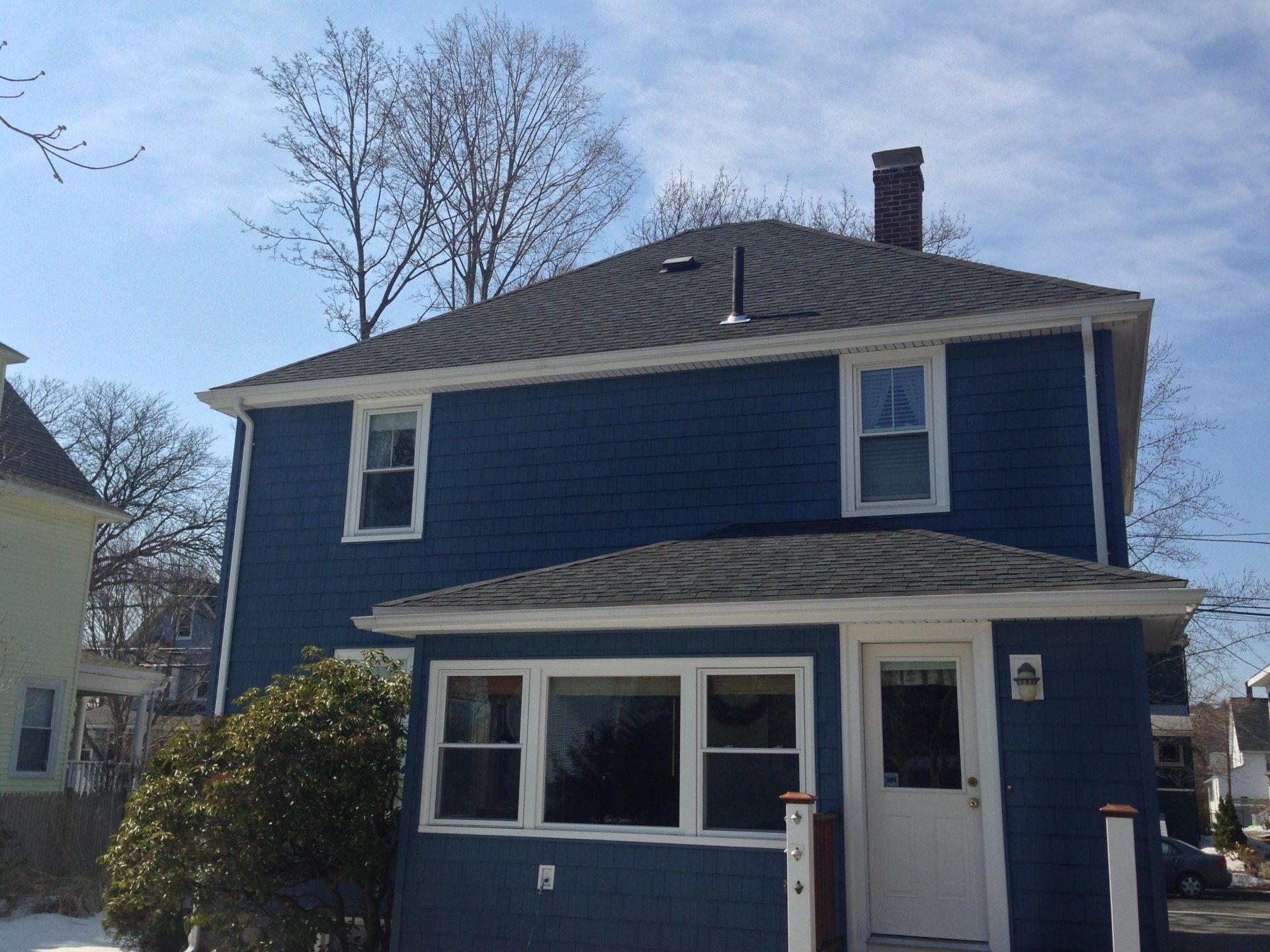 A home in Melrose, MA with a new roof installed by Crowell Construction