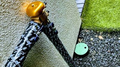 A close up of a hose with a bell on it.