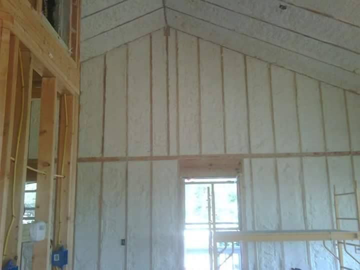 A house is being built with a lot of insulation on the walls.