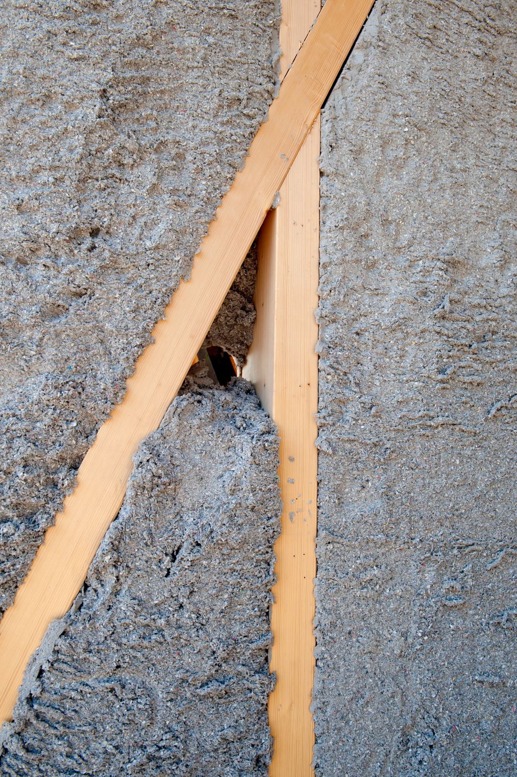 A close up of a piece of wood and a piece of carpet.