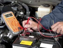 Mechanic Checking Car Battery Voltage