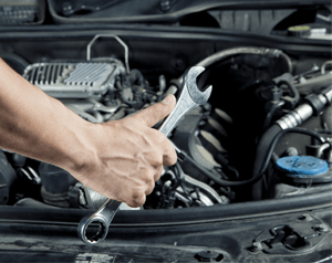 Mechanic Working on Engine Bay