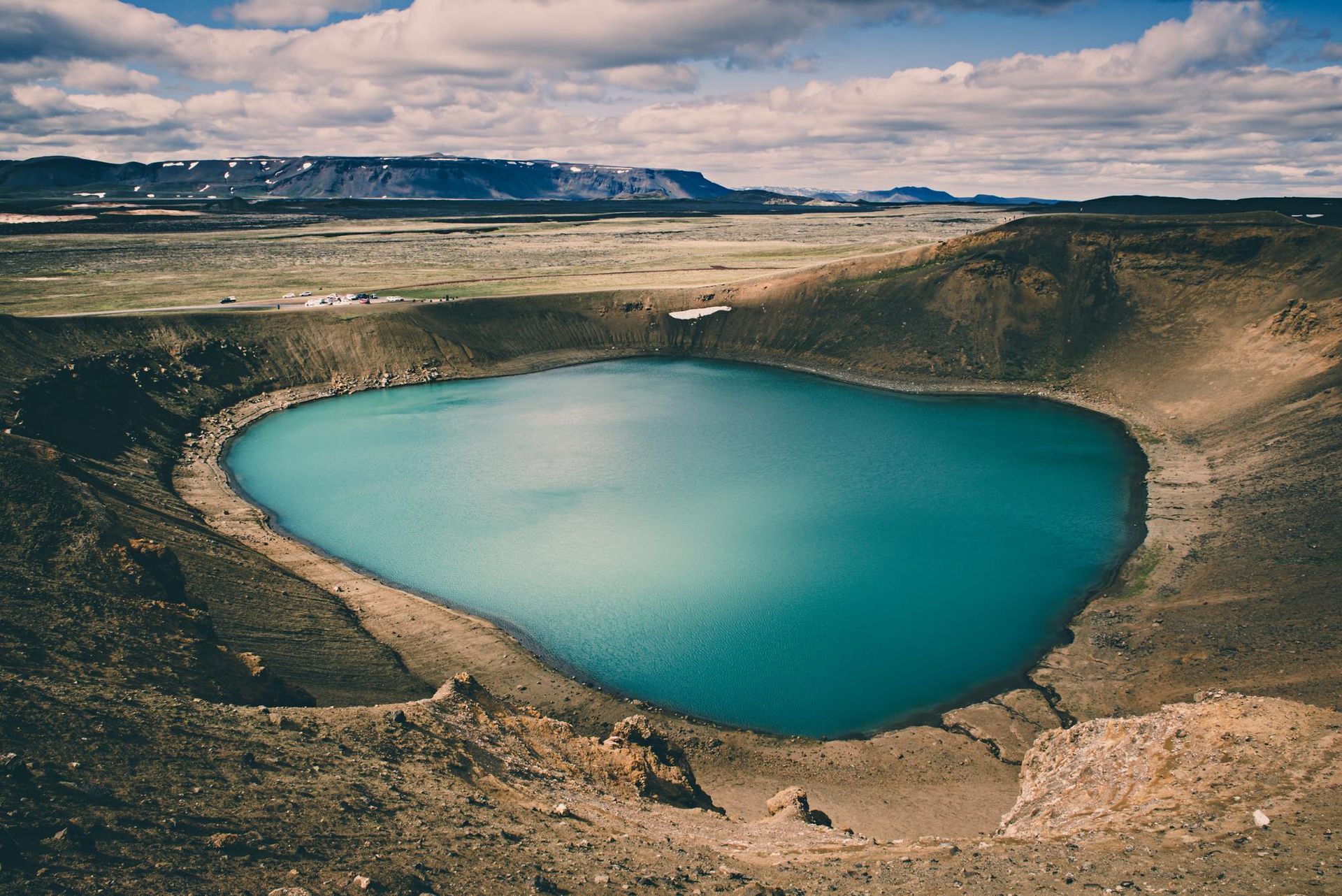 A heart shaped lake in the middle of a desert