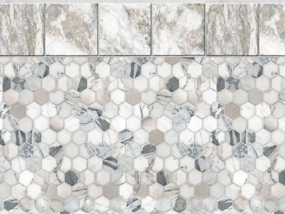 A close up of a tile floor with hexagon tiles and marble tiles.