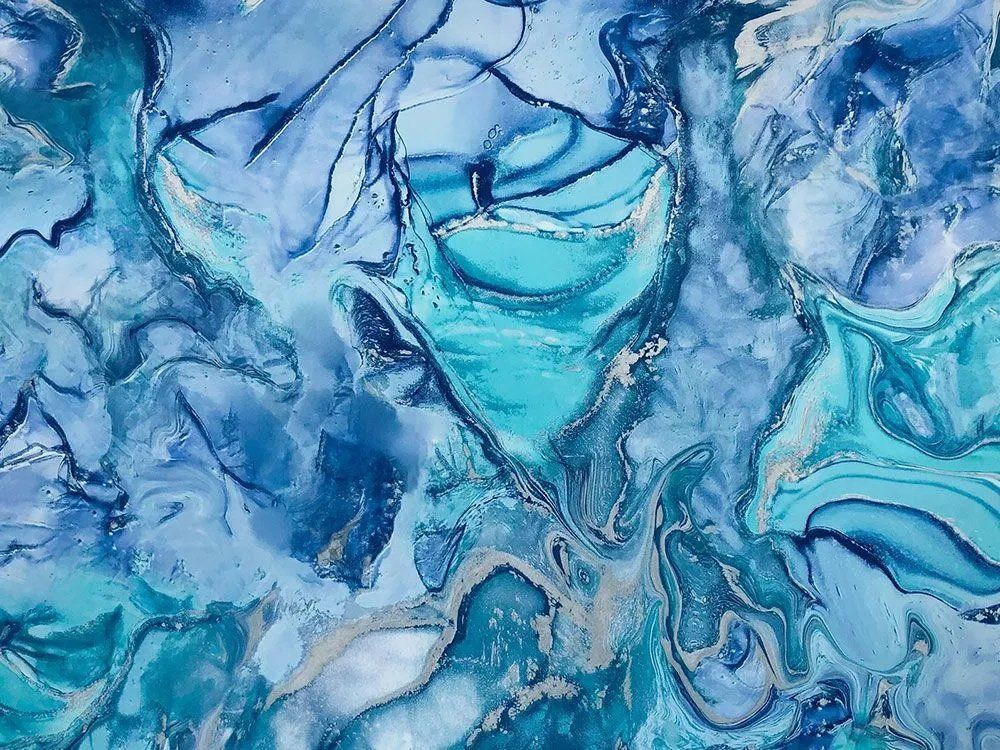 A close up of a blue and white marble painting.