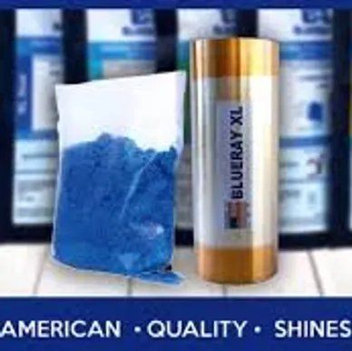 A bag of blue powder next to a bottle of blueray xl.