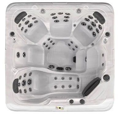 A white hot tub with a lot of holes in it on a white background.