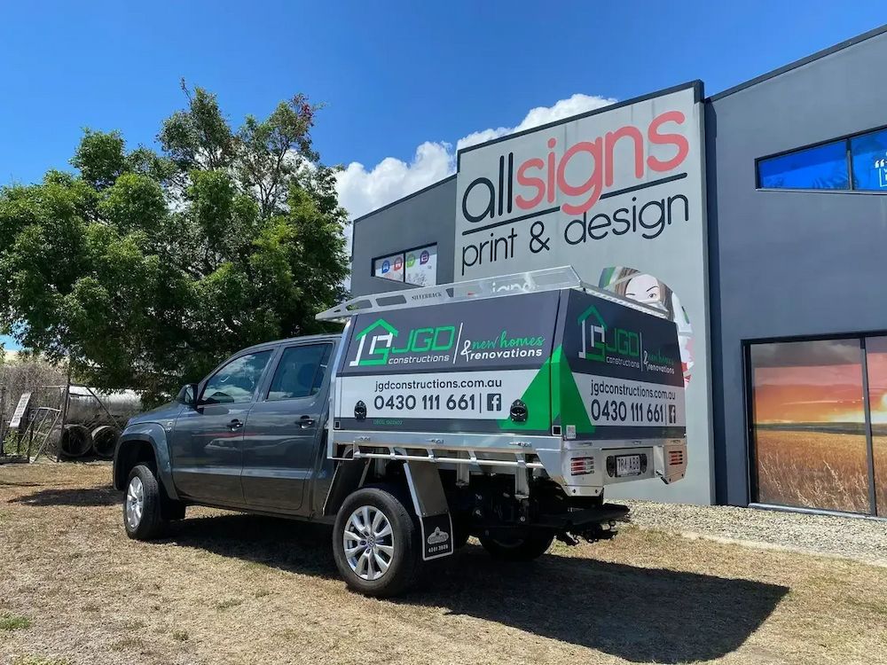 Gray Truck With Canopy Parked in Front of a Building — JGD Constructions in Lake Eacham, QLD