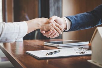 Business Man Shaking Hands — Sioux City, IA — Andersen Investment & Insurance