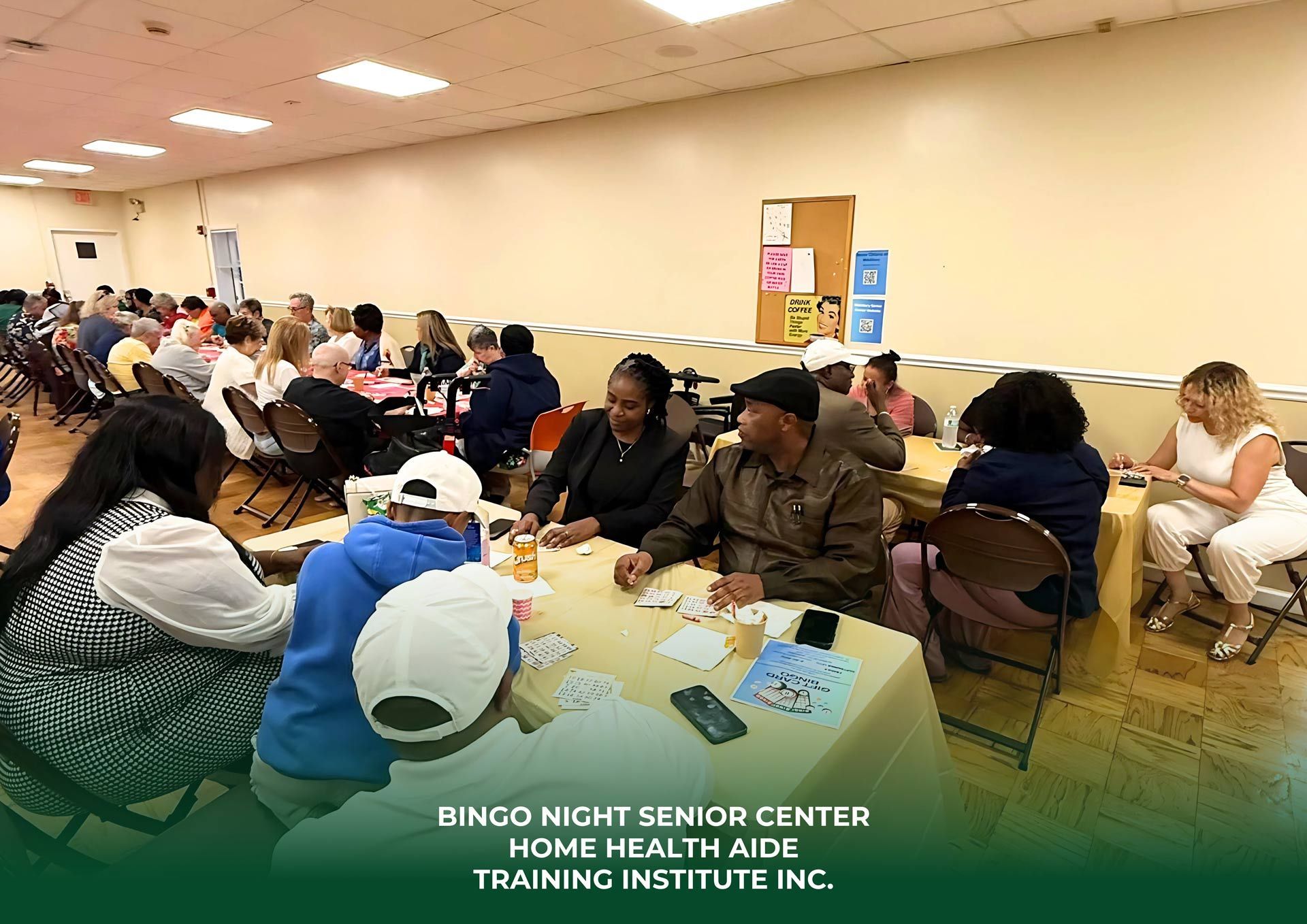 Seniors playing games at a community center. People sit at tables, enjoying activities and socializing.