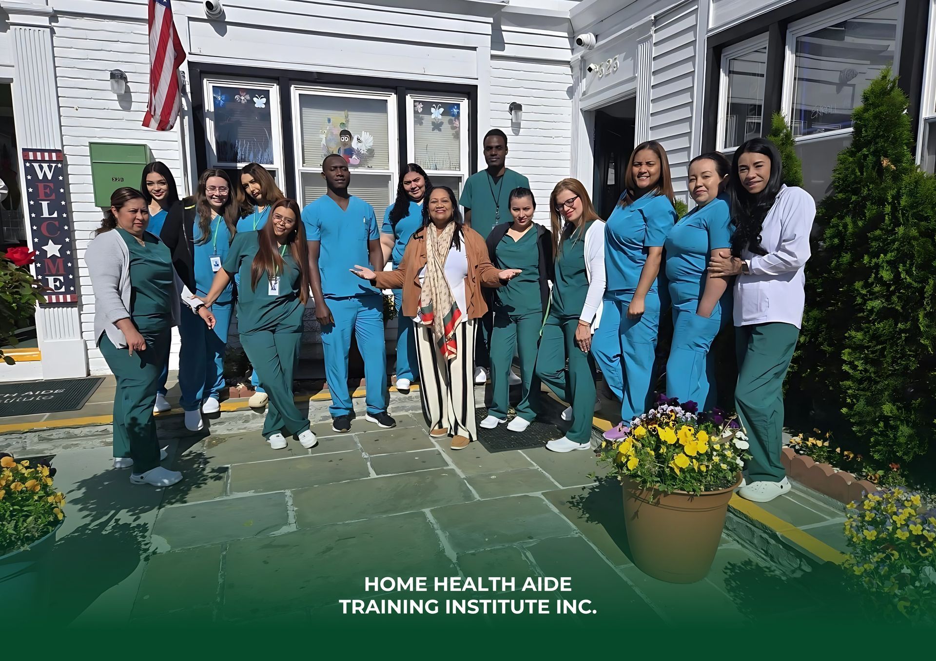 A group of people in scrubs are posing for a picture in front of a building.