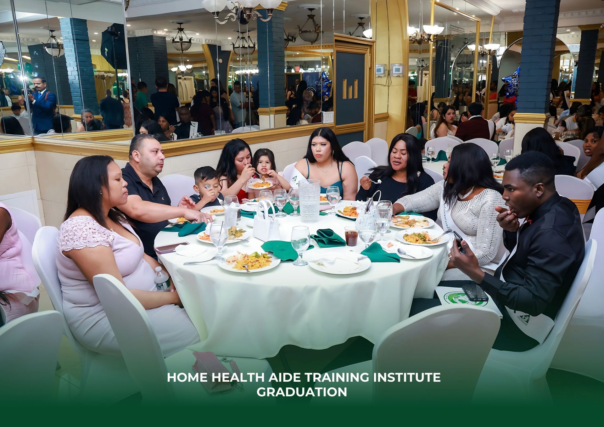 A group of people are sitting at a table with plates of food.