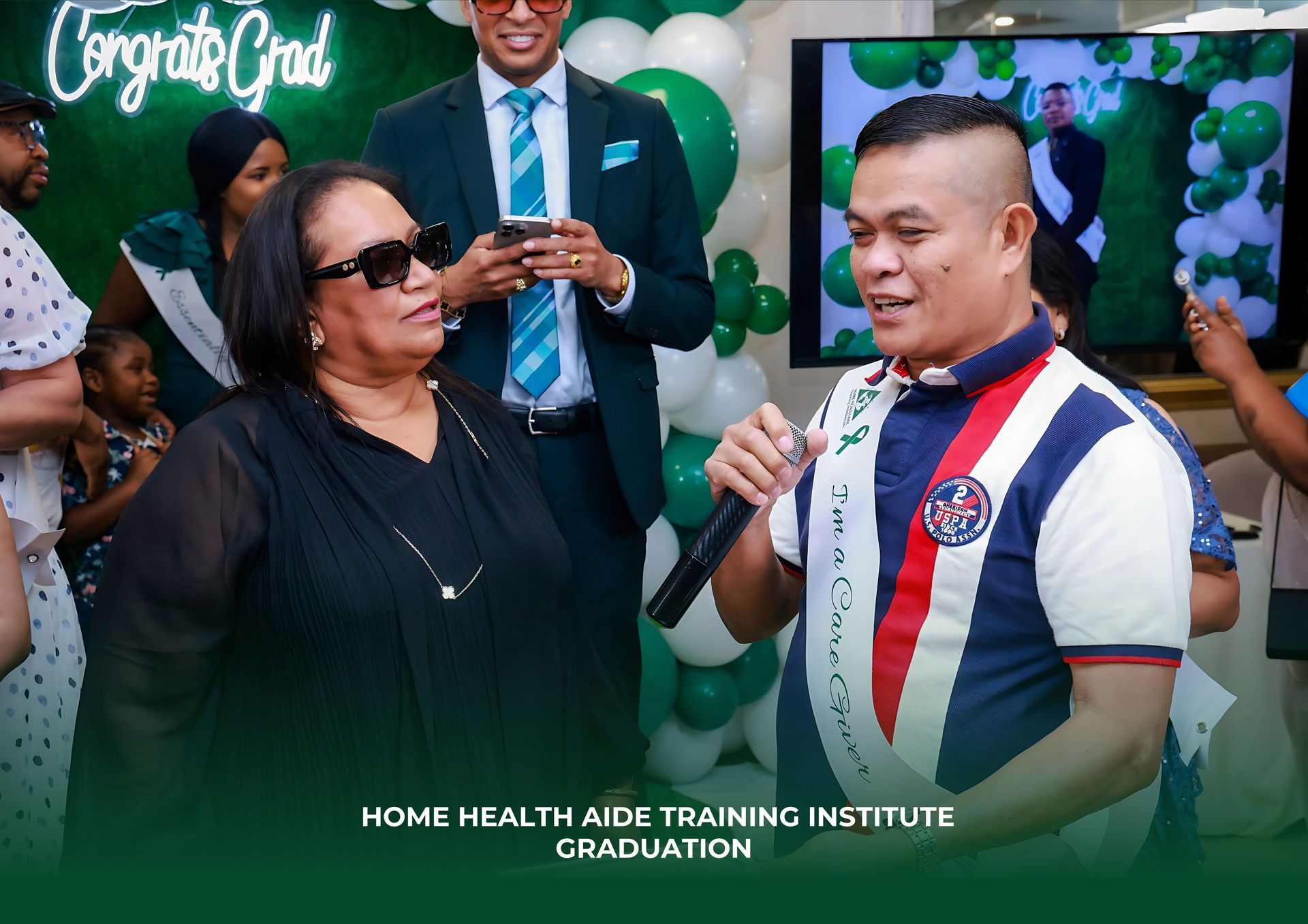 A man is holding a microphone while standing next to a woman.