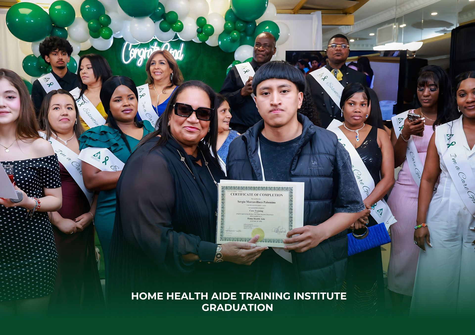 A group of people are standing around a man holding a certificate.