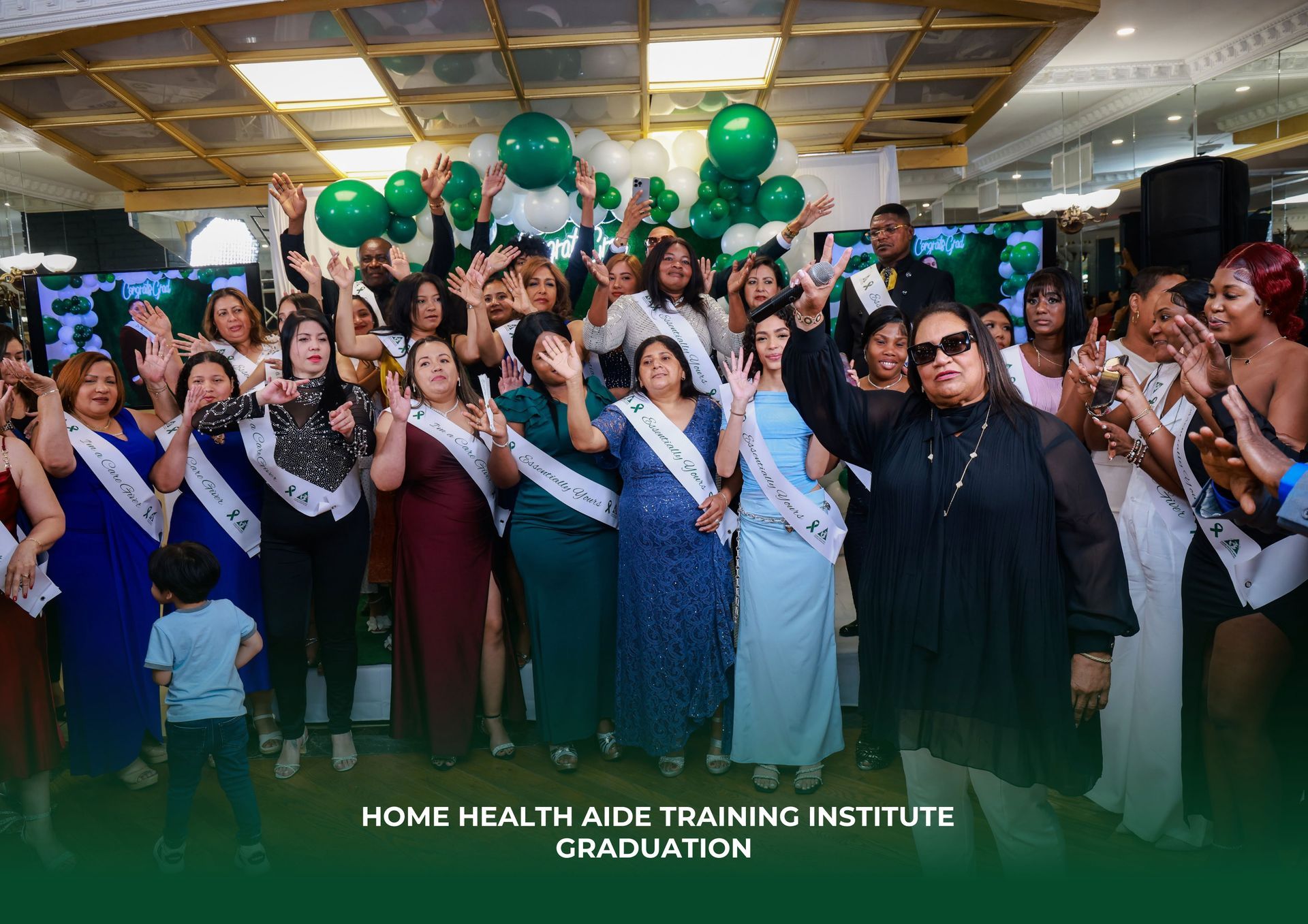 A group of women are posing for a picture at a graduation ceremony.