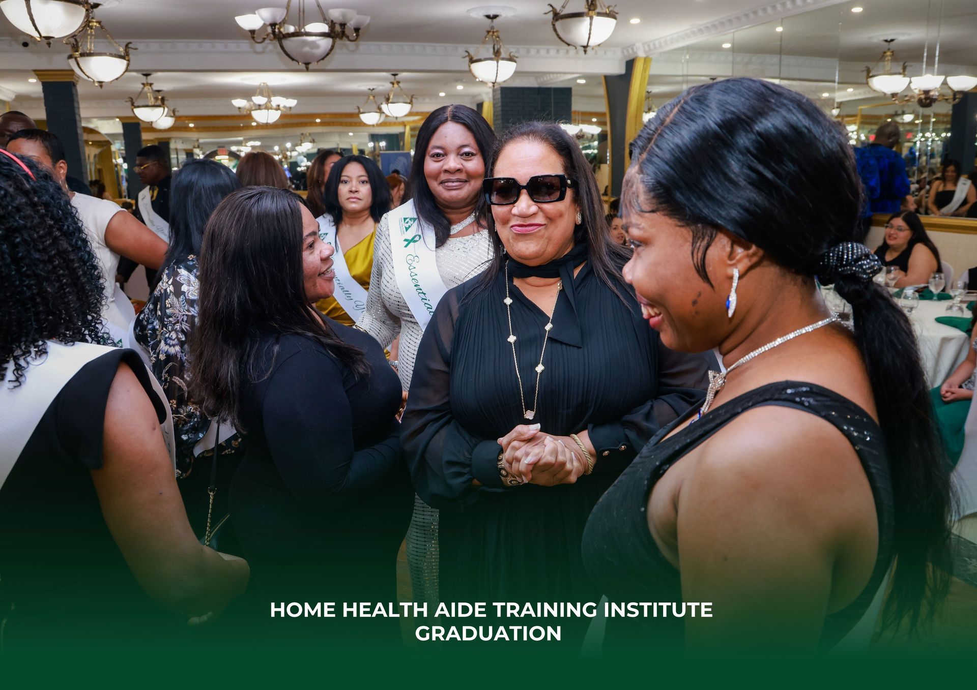A group of women are standing in a room talking to each other.