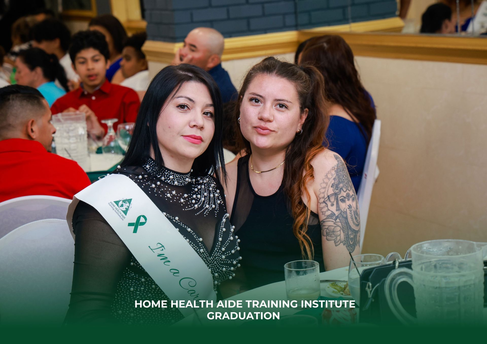 Two women are posing for a picture at a Home Health Aide Training Institute graduation.
