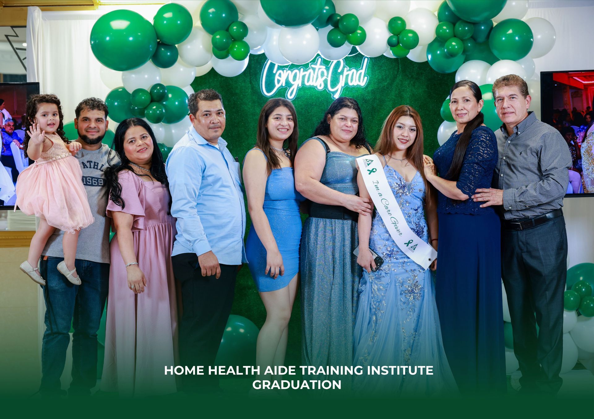 A group of people are posing for a picture at a graduation party.