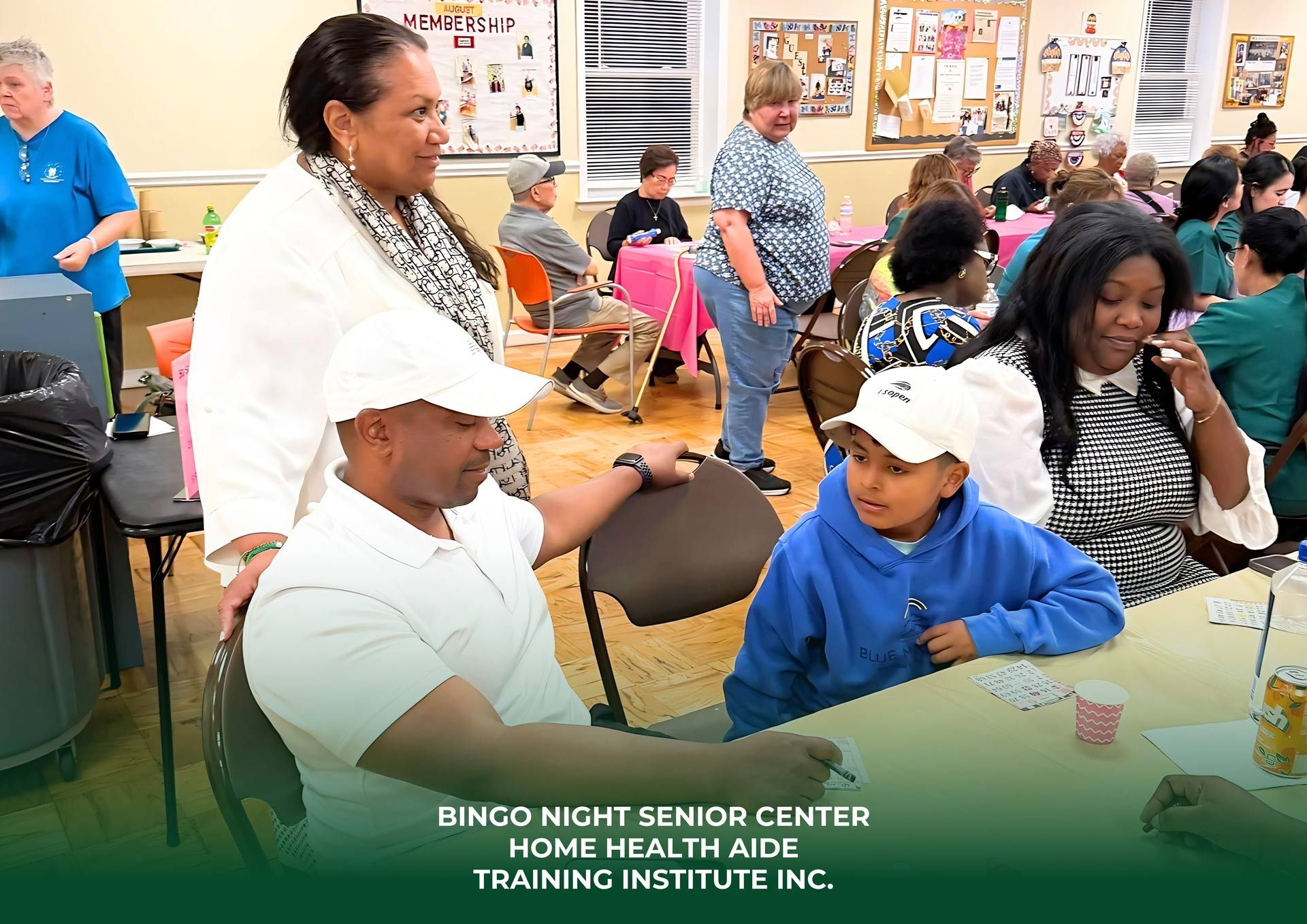 People at a senior center, playing cards and socializing. Many are wearing hats.