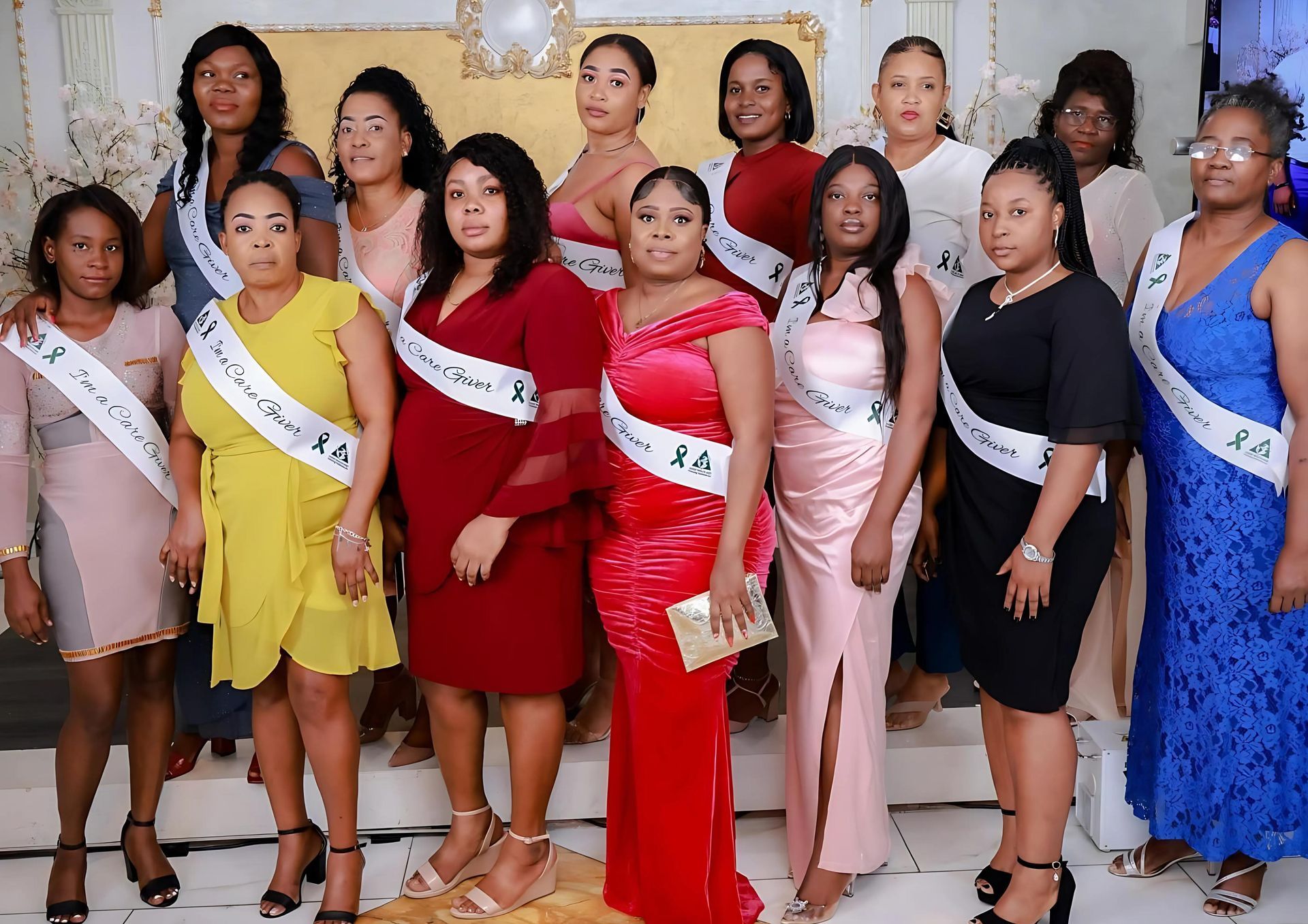 A group of women are posing for a picture together.