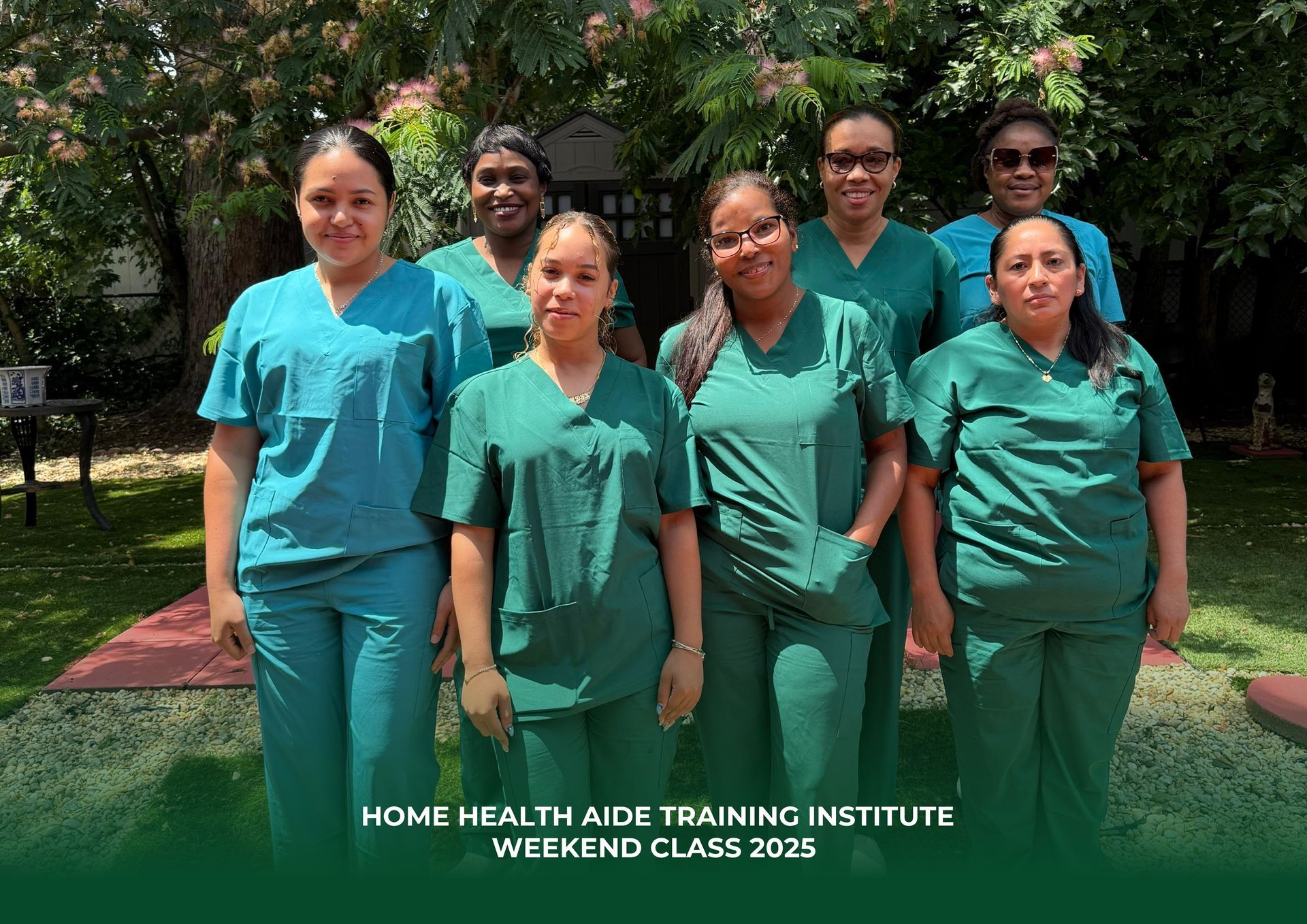A group of women in scrubs are posing for a picture.
