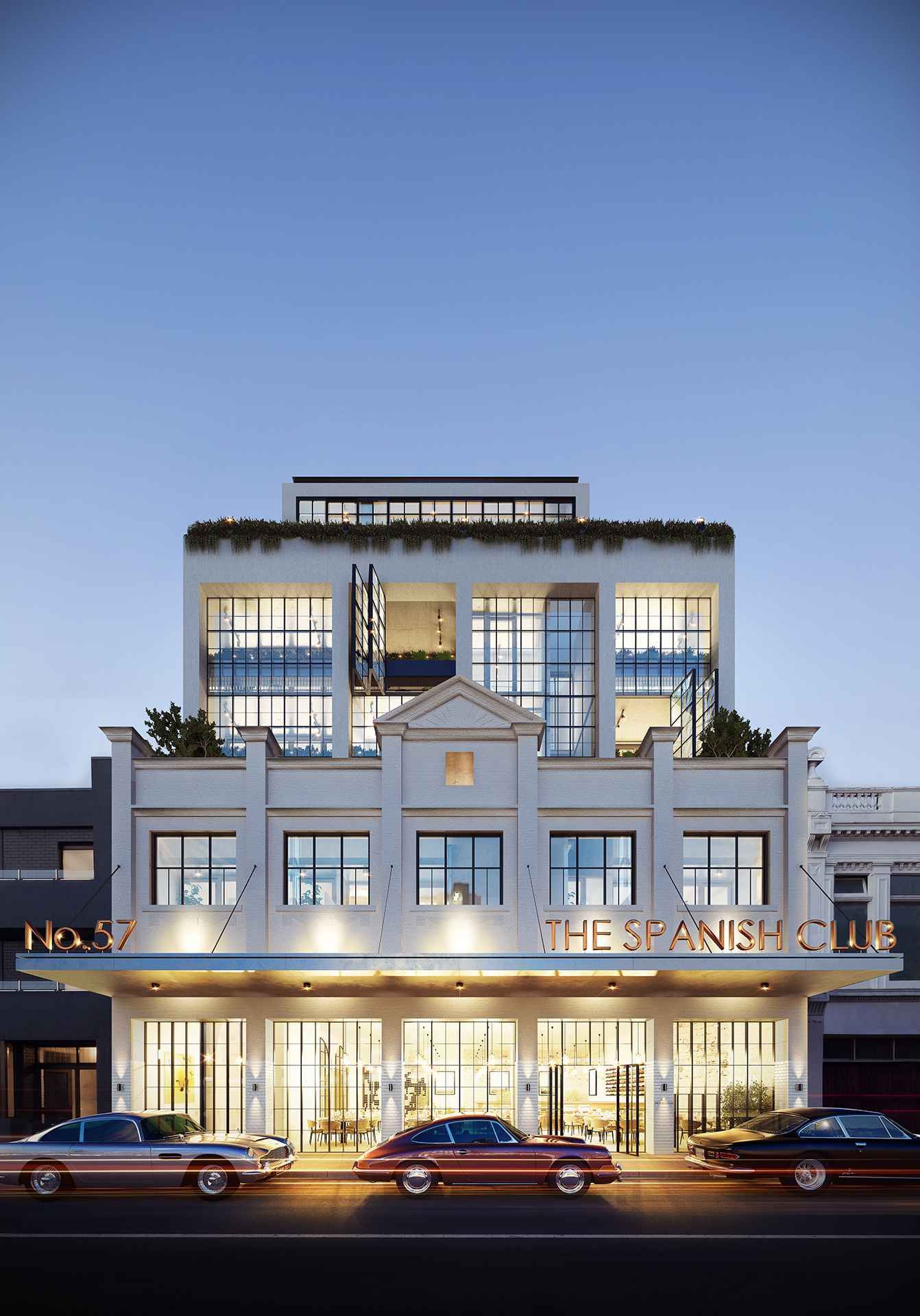 A building with a lot of windows and cars parked in front of it.