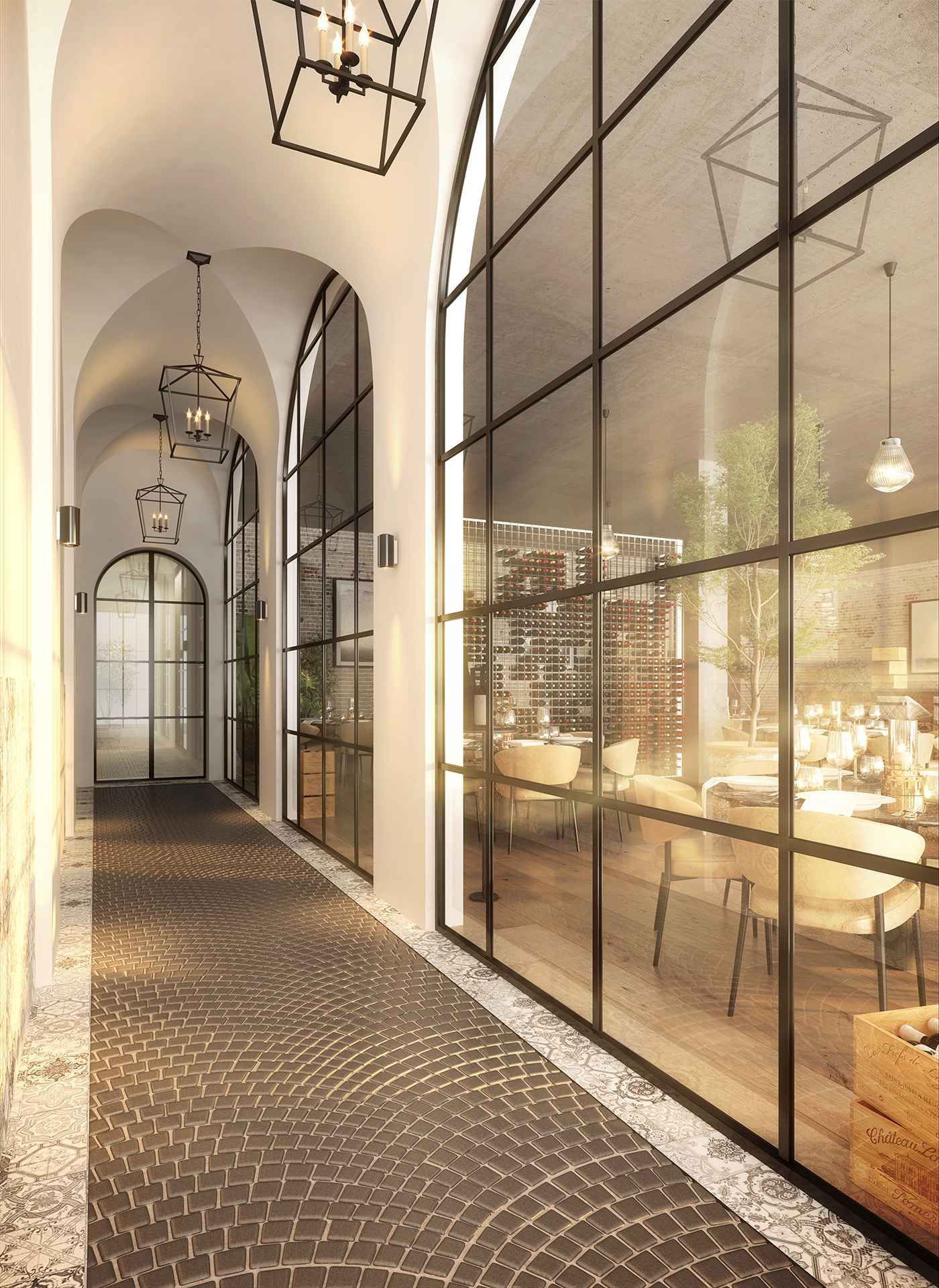 A hallway with a lot of windows and tables and chairs.