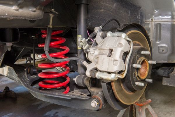 A Close Up Of A Cars Suspension And Brake System — CS Mechanical Repairs & Services In Wauchope, NSW