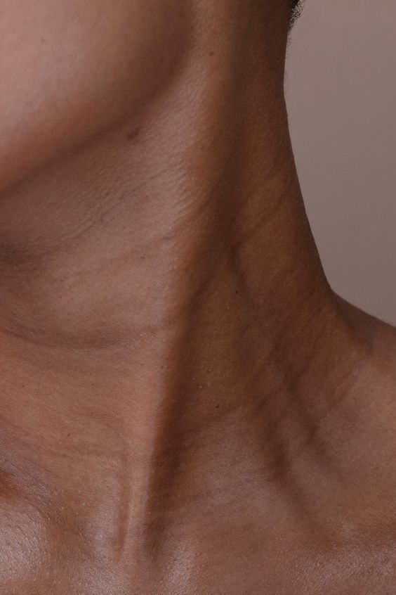 A close up of a woman 's neck and chest.