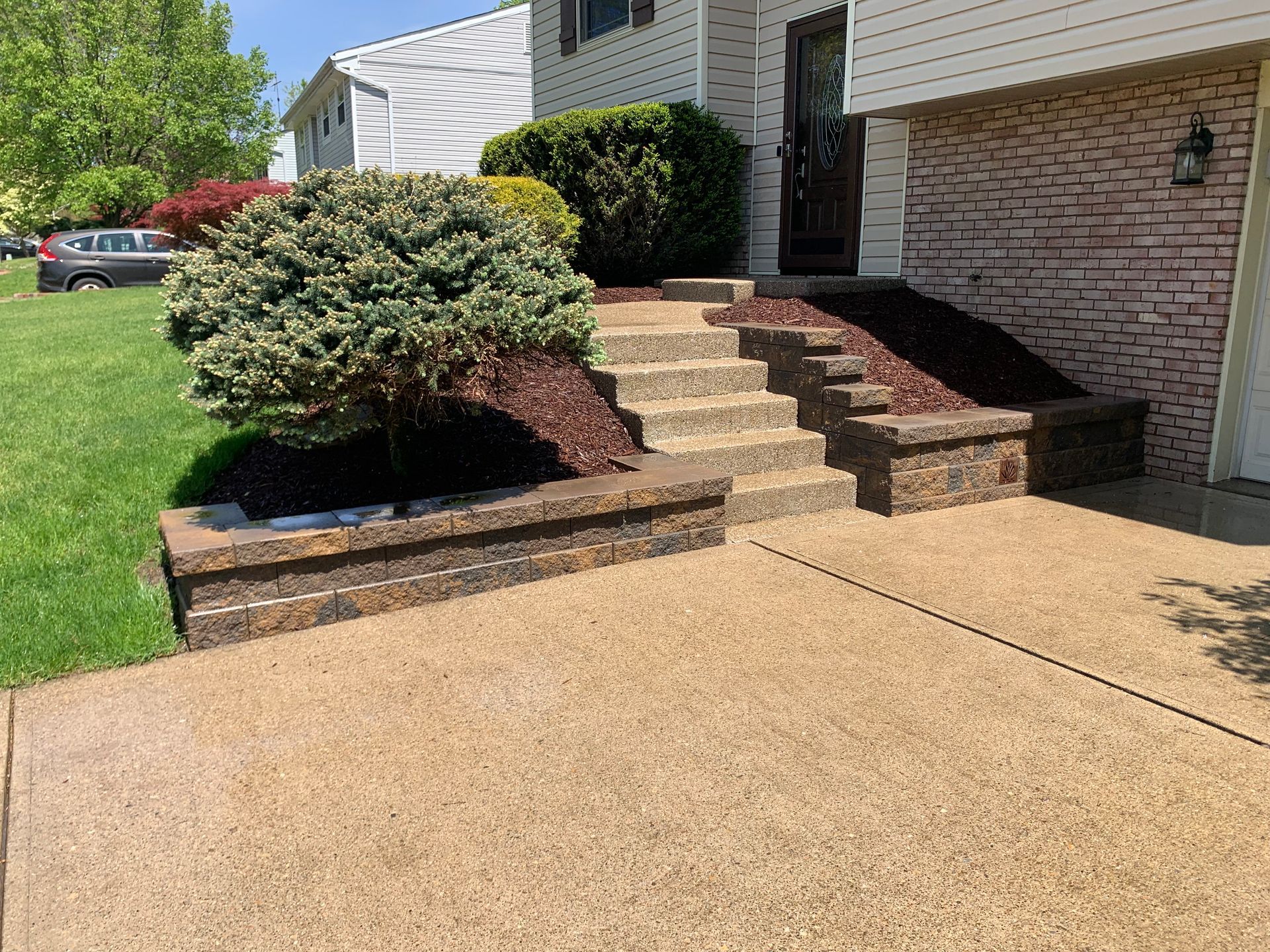There are stairs leading up to the front of a house.