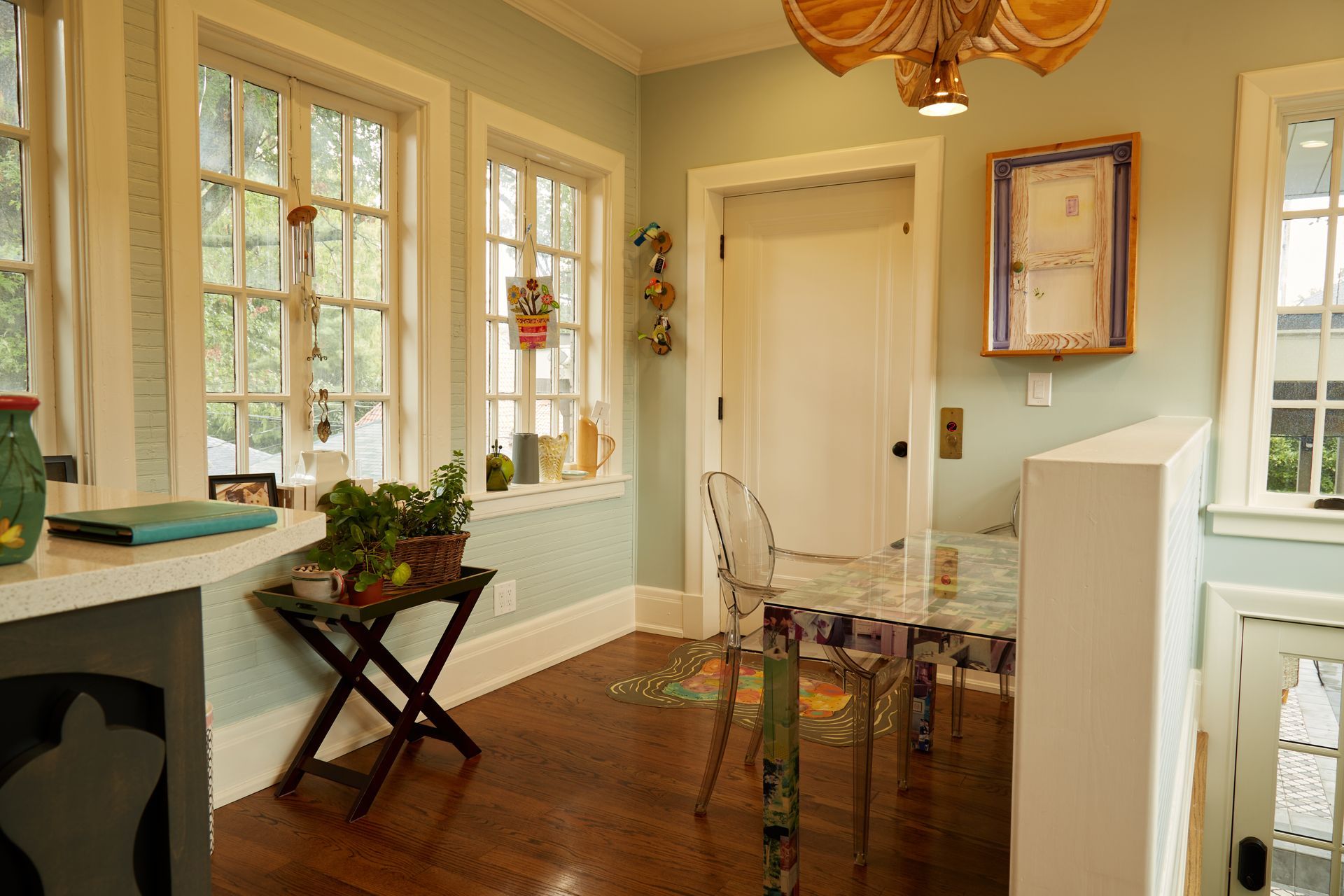 A room with a table and chairs in it