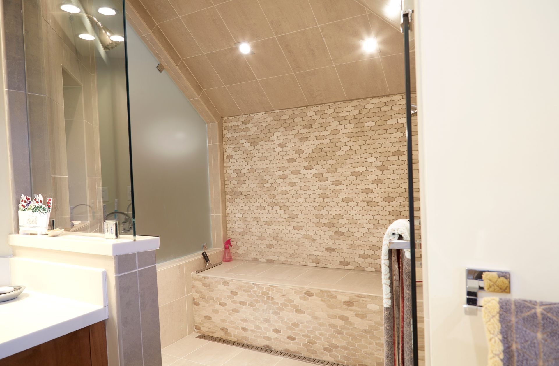 A bathroom with a bathtub and a walk in shower.