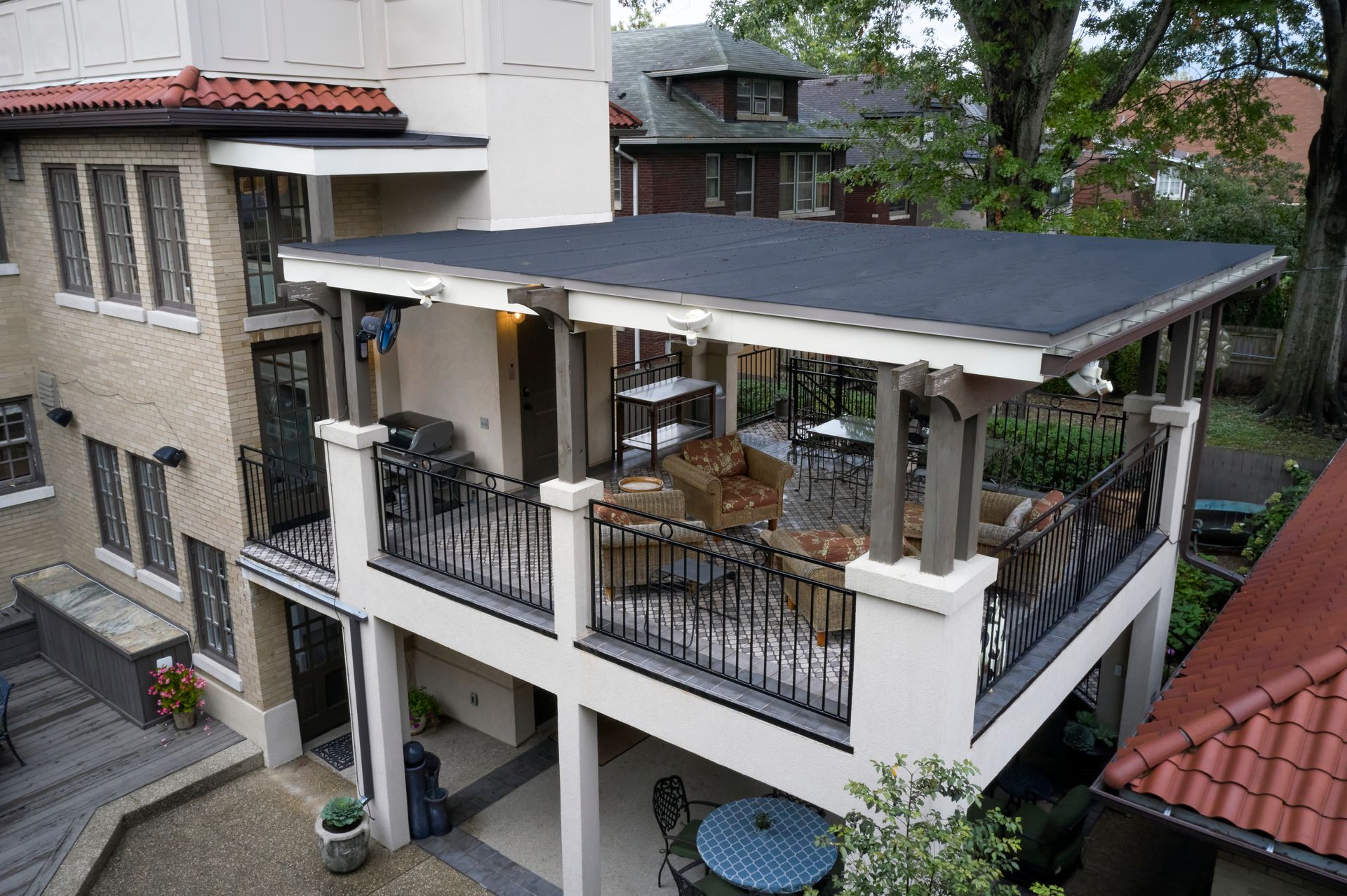 An aerial view of a house with a large balcony