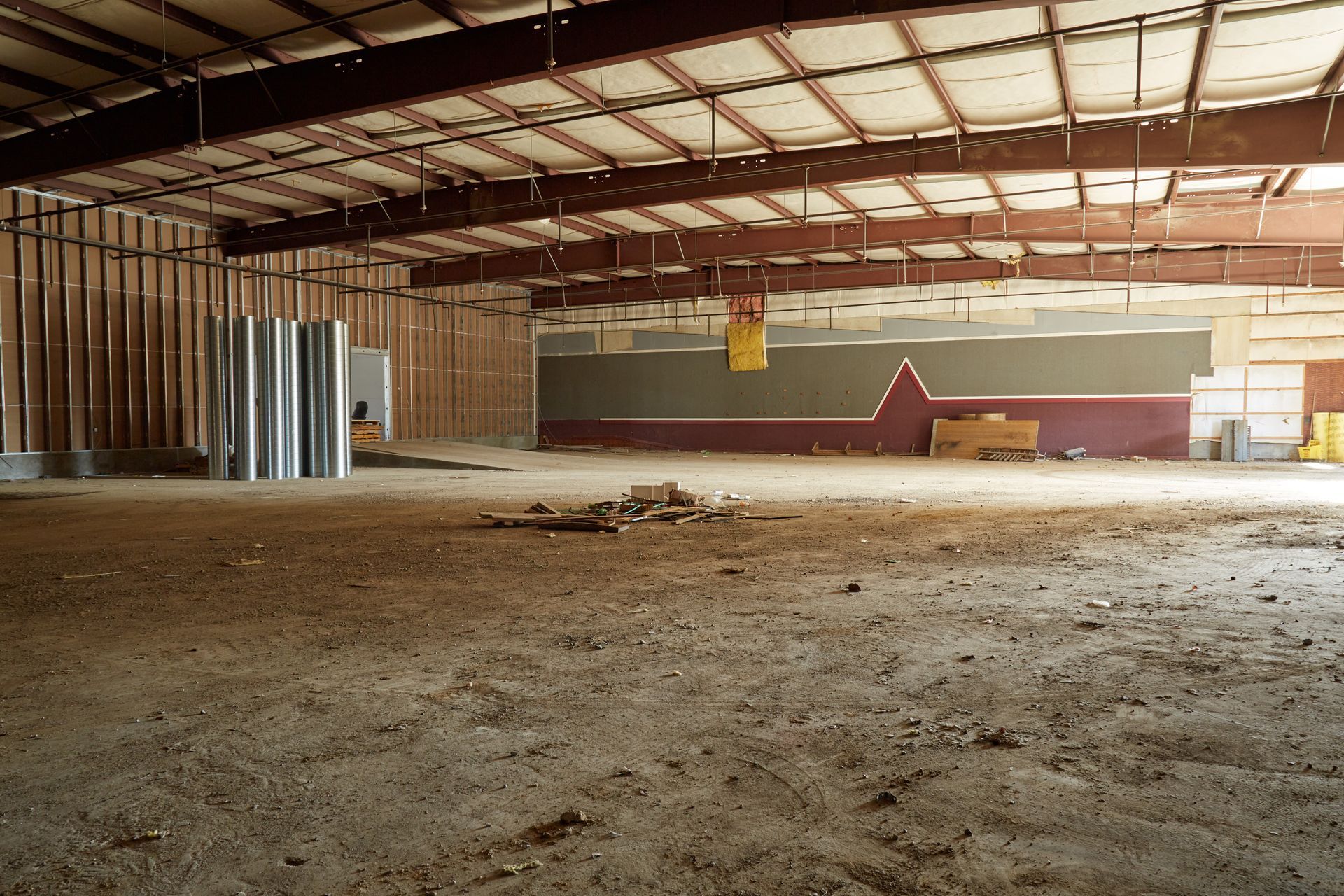 An empty building with a sign that says no parking