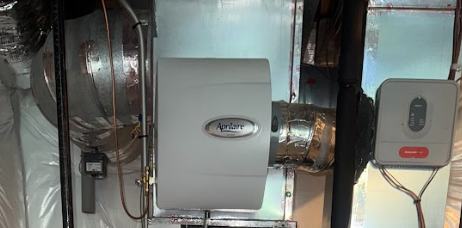 An air conditioner is being installed in a basement in a house.