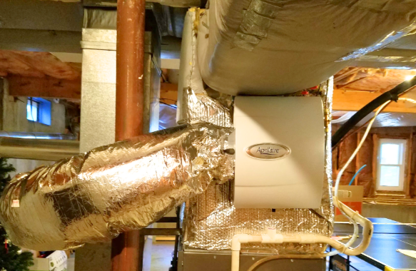 A picture of a heating system in a basement.