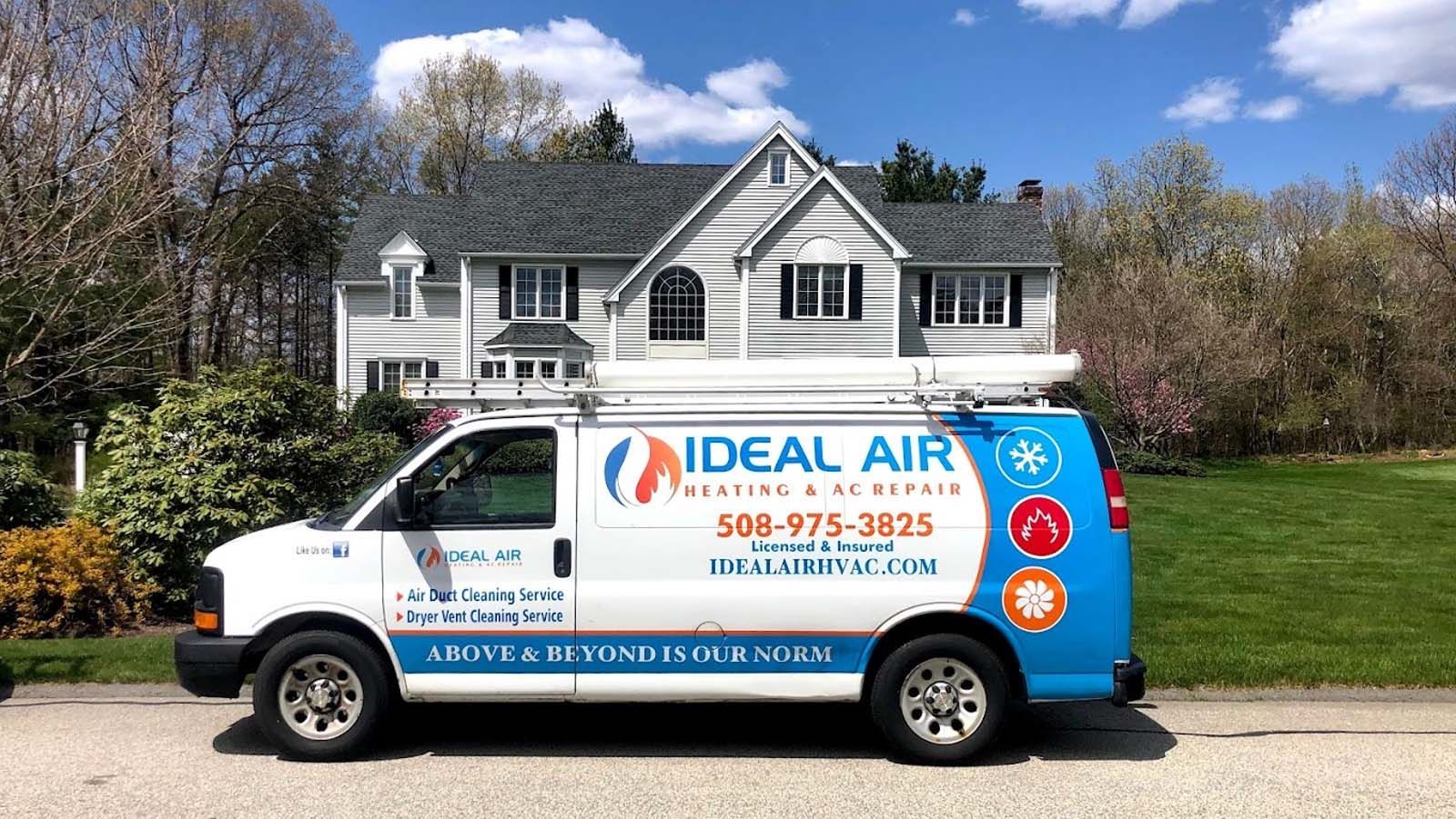 An ideal air van is parked in front of a house.