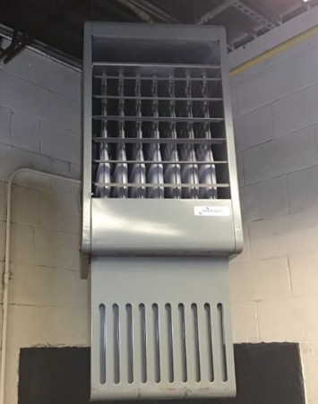 A gray heater is hanging from the ceiling of a building