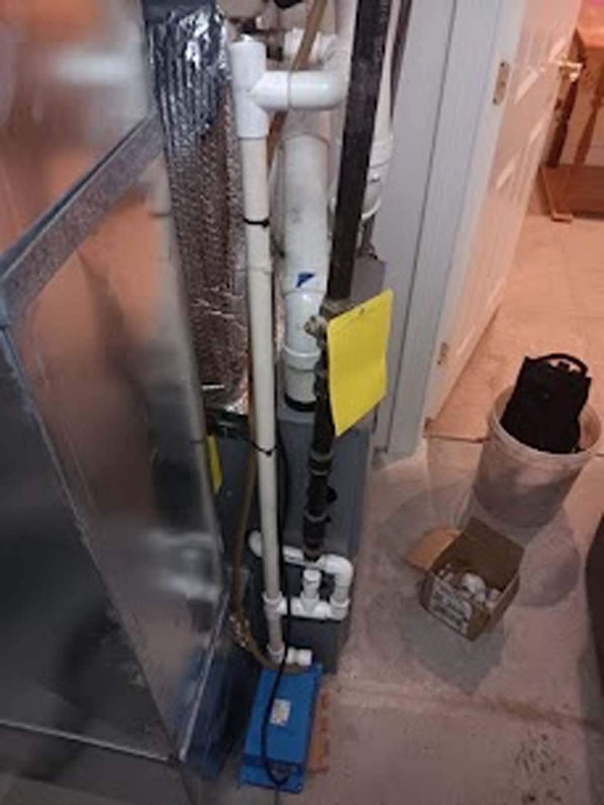 A picture of a heating system in a basement.