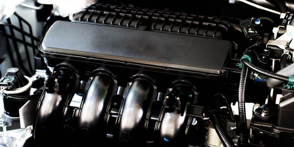 A close up of the engine of a car.