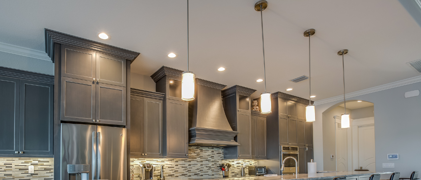 a photo of stunning light fixtures installed in a new kitchen. The light fixtures in the kitchen add a beautiful finish to the kitchen. 