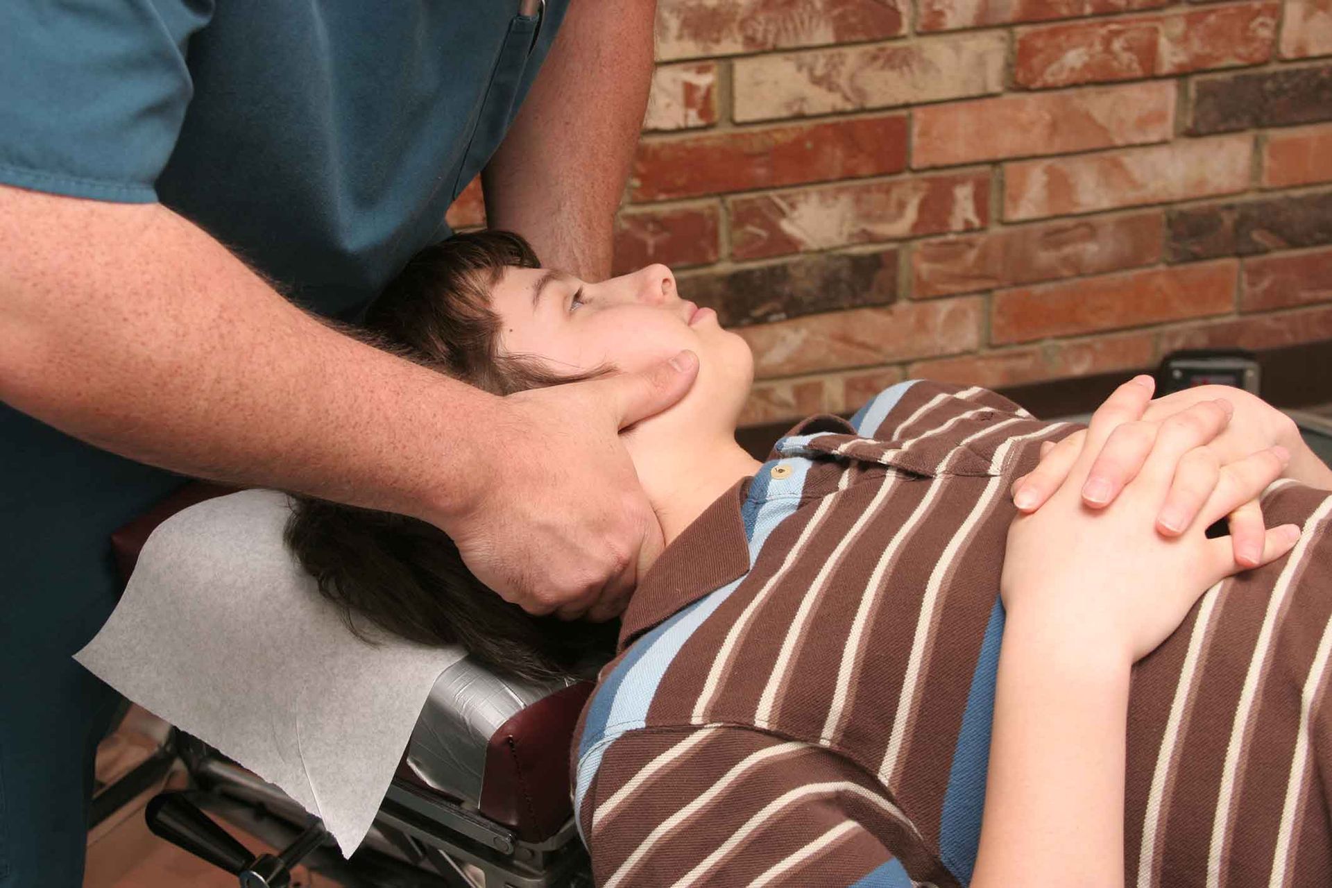 A Person Is Laying On A Table Getting A Massage From A Doctor – Dunbar, WV - Smith & Jones Chiropractic