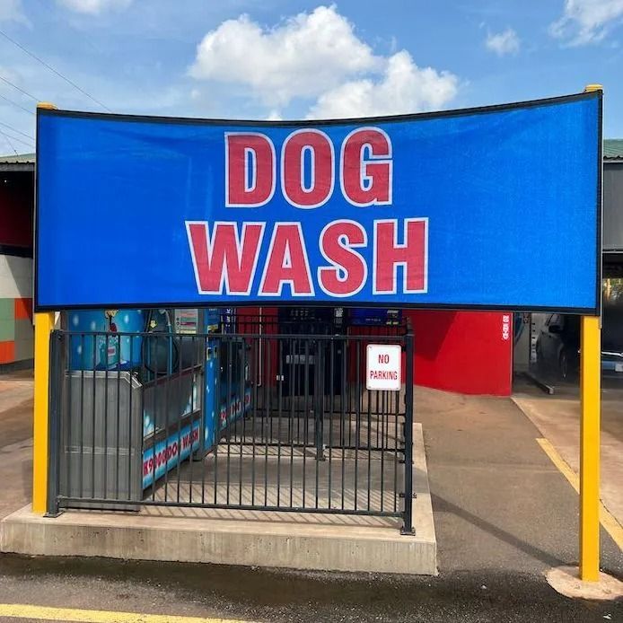 Dog wash station with a blue sign reading