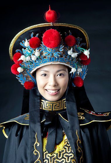 A woman wearing a costume with a crown on her head